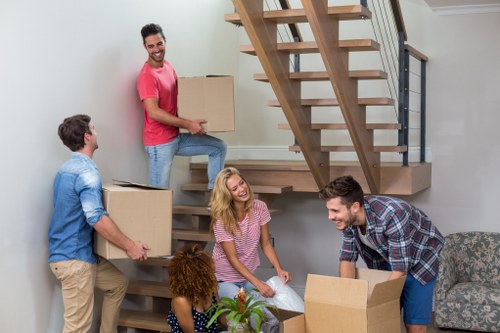 Removal team helping with a Brixton home move on a busy South London street