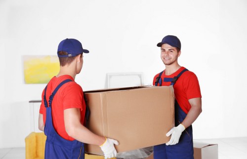 Moving van and packed boxes for a home move in Brixton