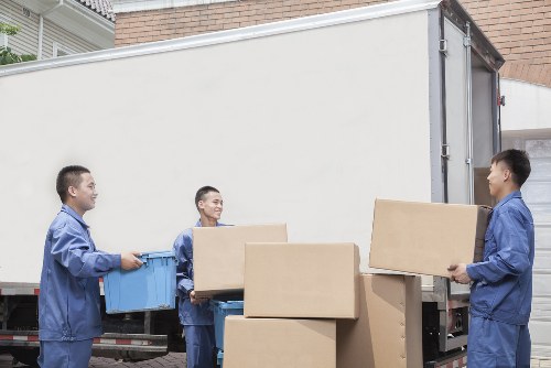 Team handling office equipment during a Brixton move