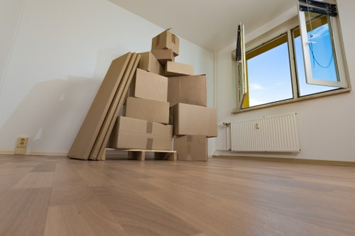 Local Brixton removals team handling furniture on a residential street