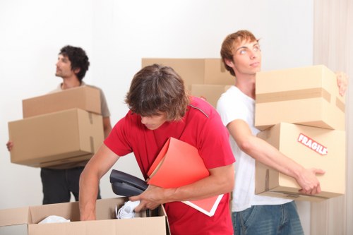 Careful loading of household items during Brixton removals service