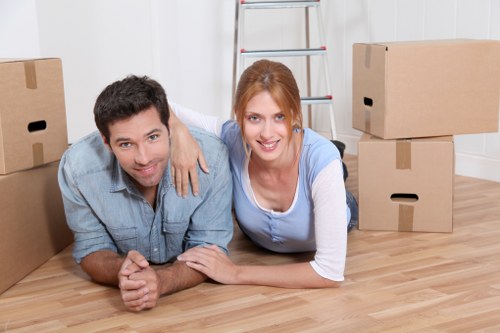 Local removals crew organizing furniture for transport