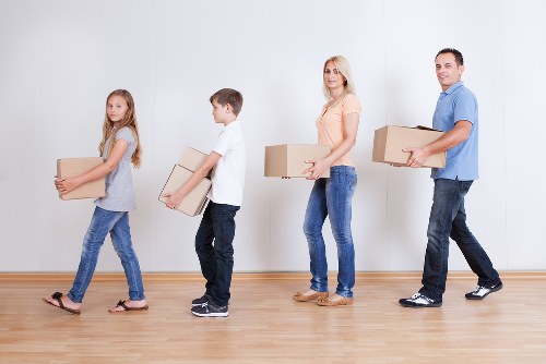 Staff member demonstrating safe handling training during removals