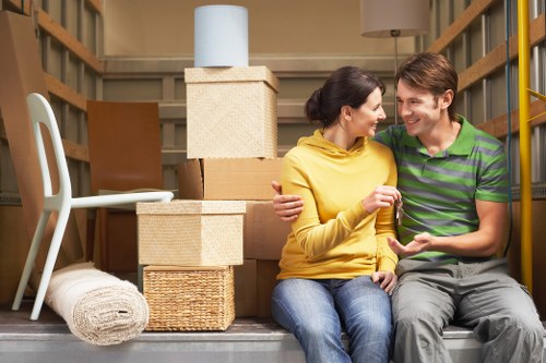 Professional moving team transporting furniture in Brixton